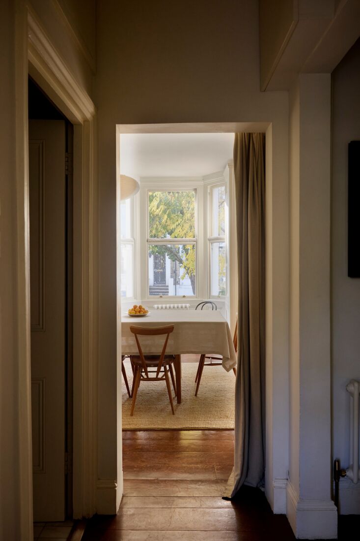 the front door is to the right; the door at left opens into the apartment&# 21