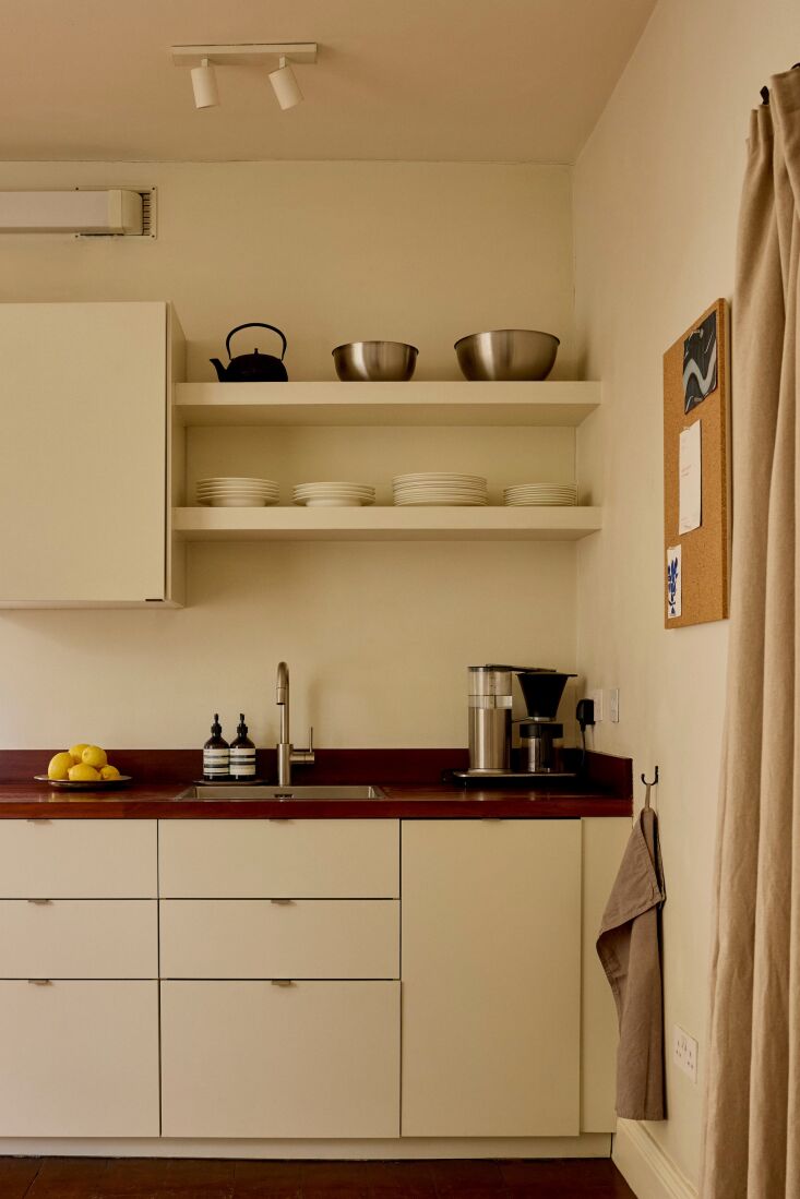 the oak countertop is finished with a dark stain to match the walnut wood floor. 18