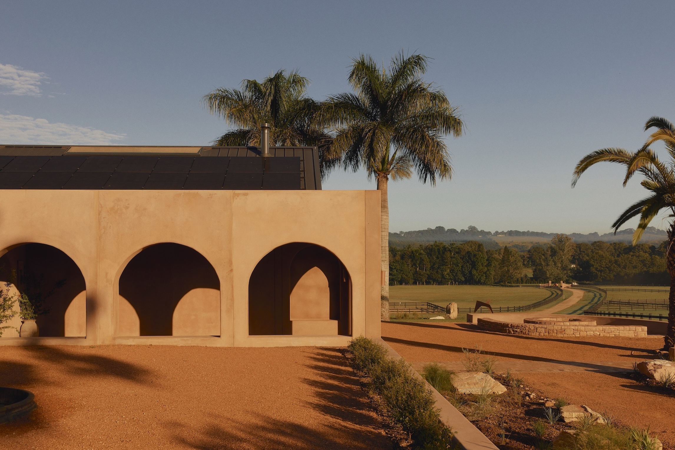 the colonnaded exterior is finished in a mix of sand and cement naturally tinte 18