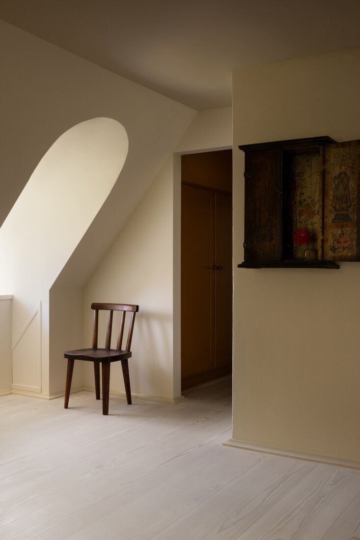 an antique chair and cabinet in the upstairs hall. 36