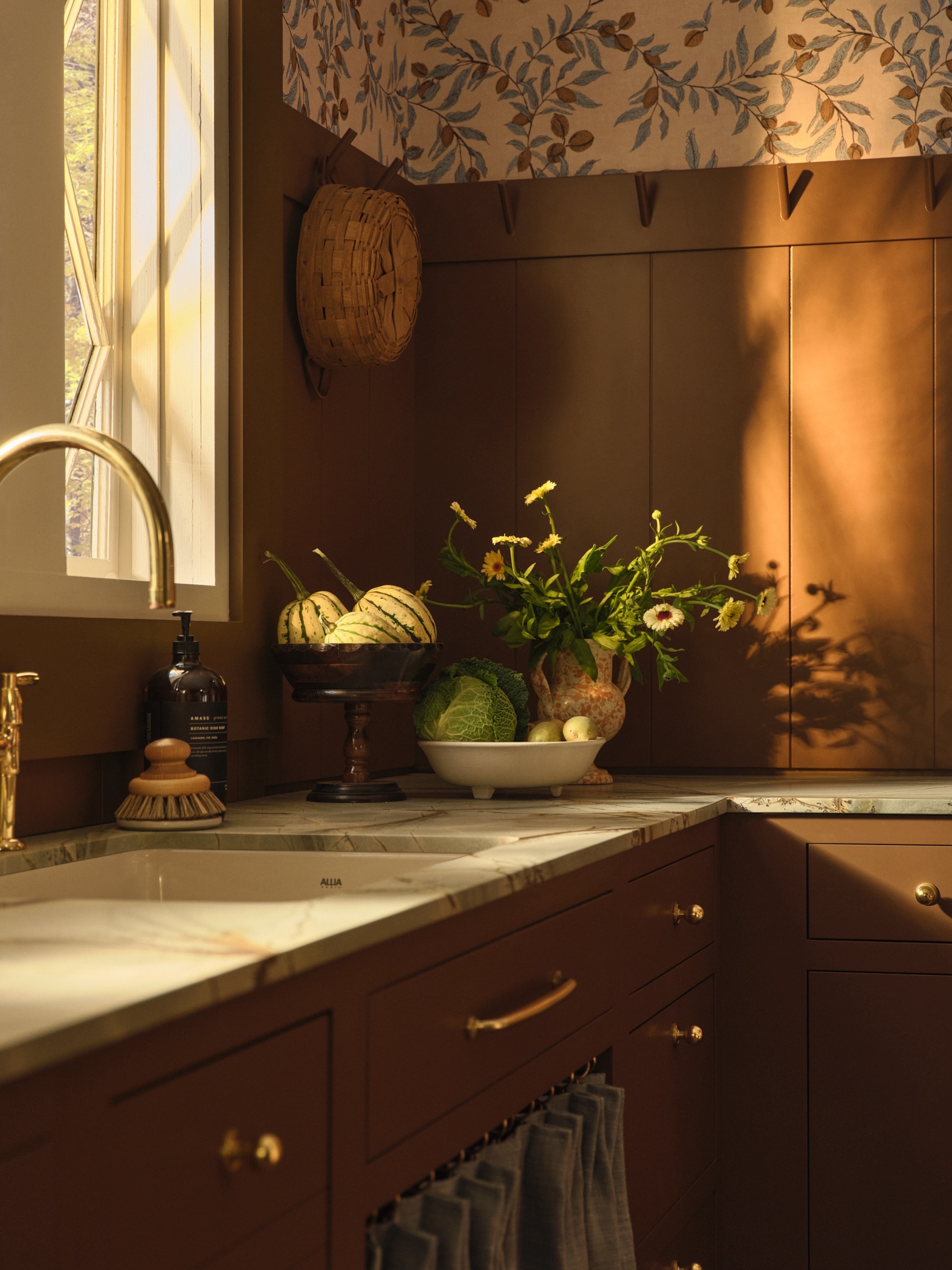 the beadboard paneled backsplash matches the range hood cover. note the pegs fo 19