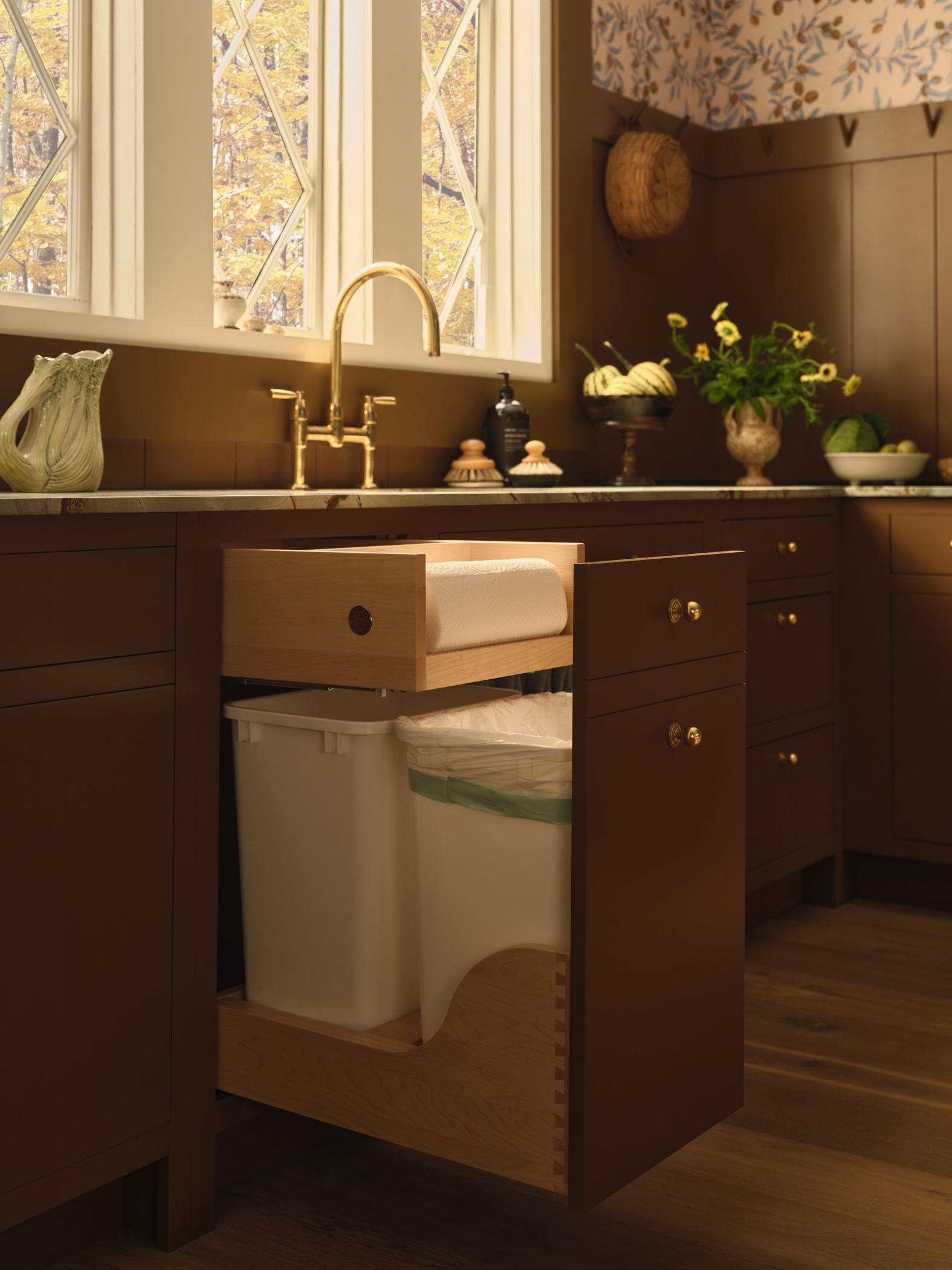 trash bins and paper towel holder are combined in a dovetailed, sink side pullo 20