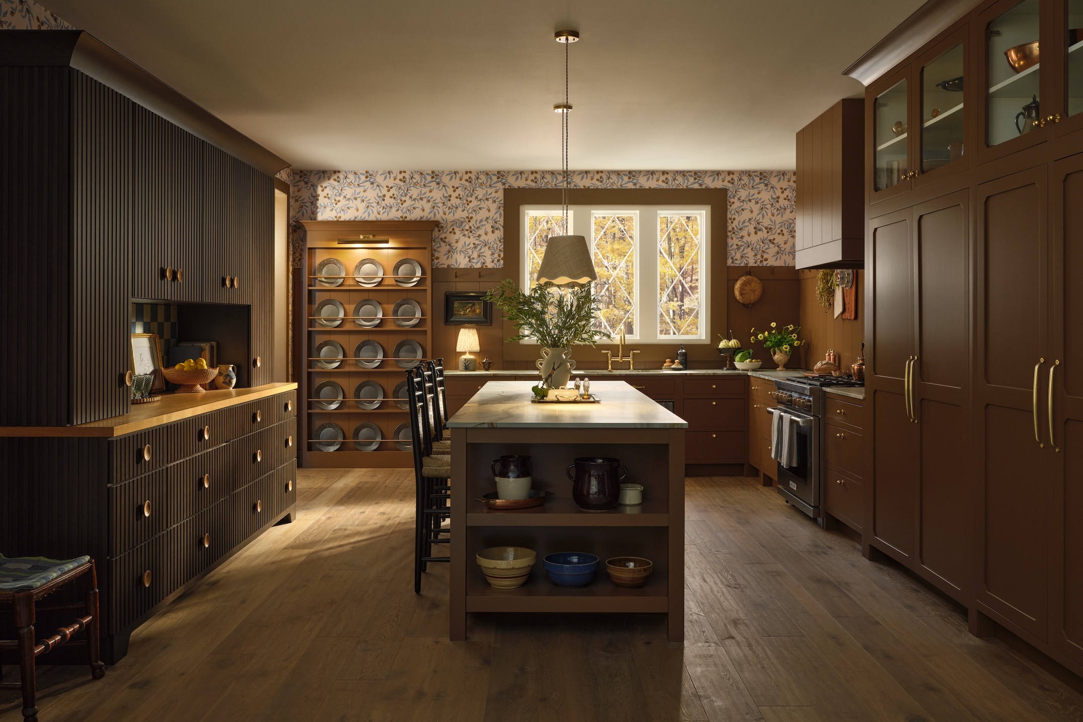 the hutch extends across the wall opposite the paneled fridge and freezer. one 22