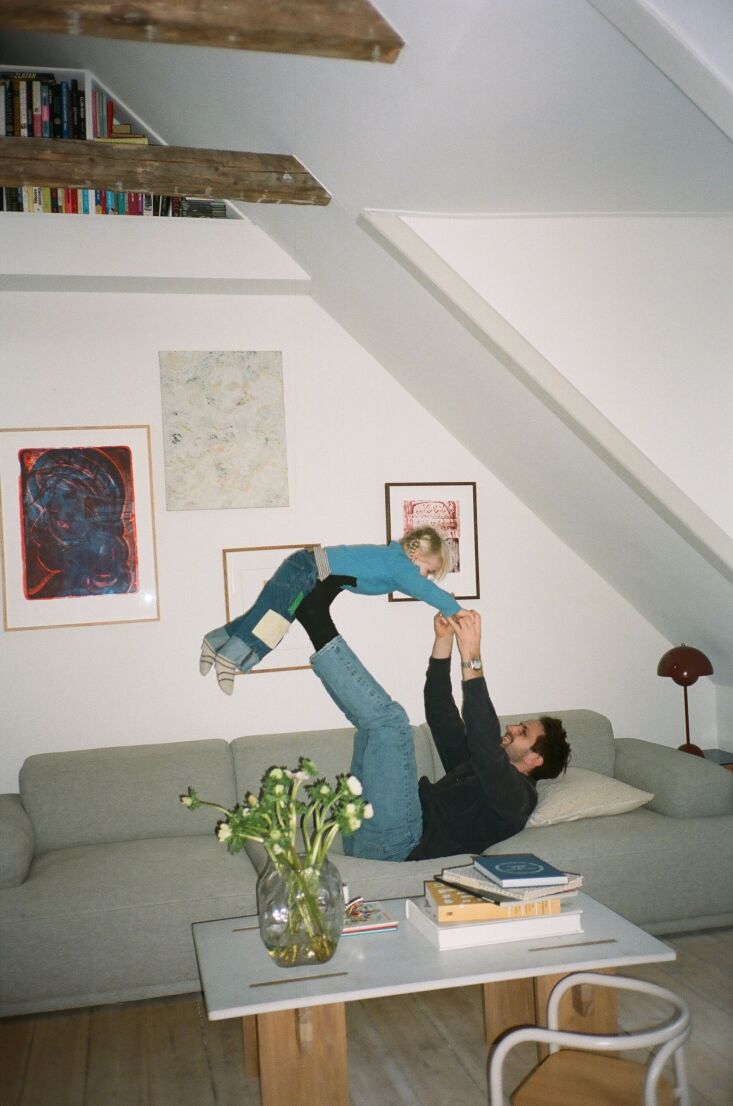 magnus and ruth on their muuto connect modular sofa. the print on the far left  19
