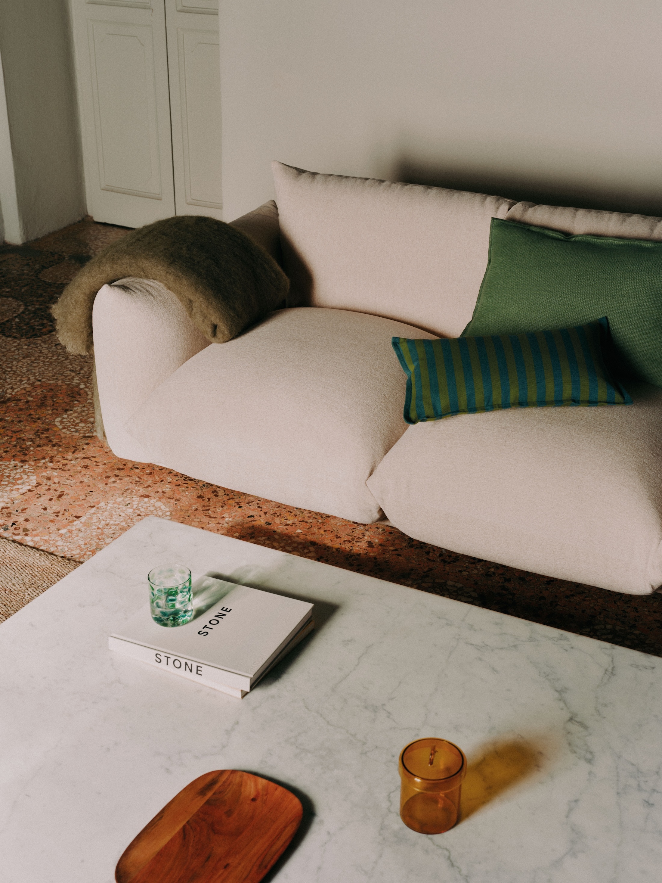a cotton cushion cover with woven stripes is \$35.99. the mottled green tumbler 18