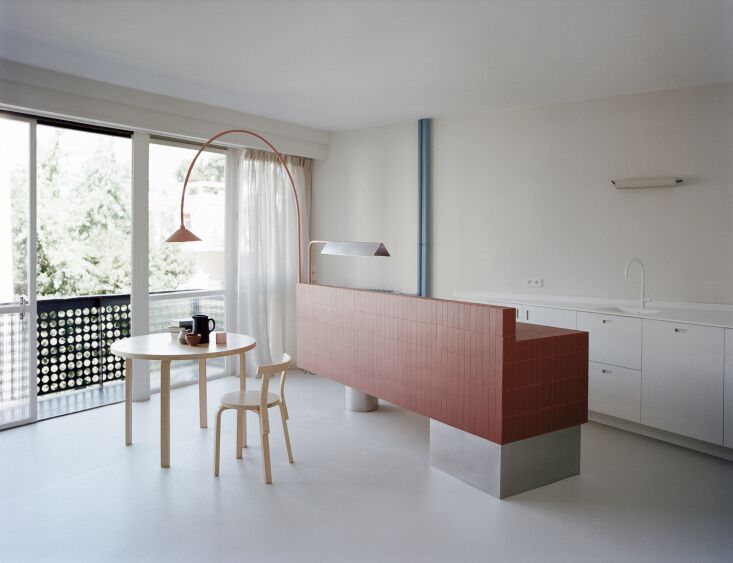the white countertop is corian and the cabinet doors, designed by rreel and mad 17