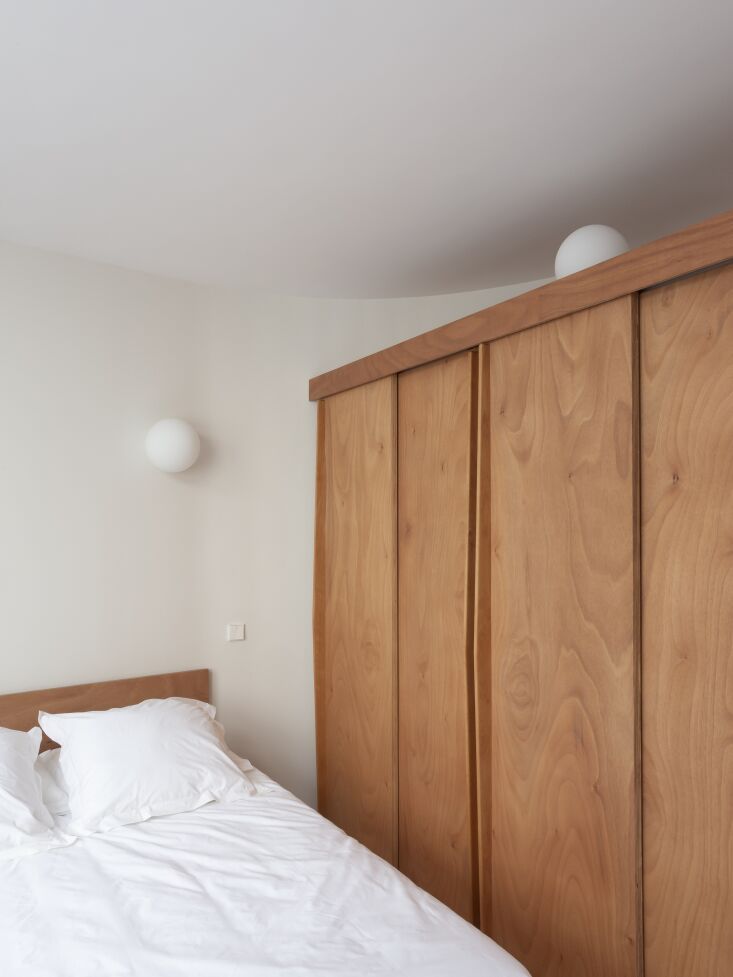 the bed, closet, and pocket door to the bedroom are all designed in marine okou 28