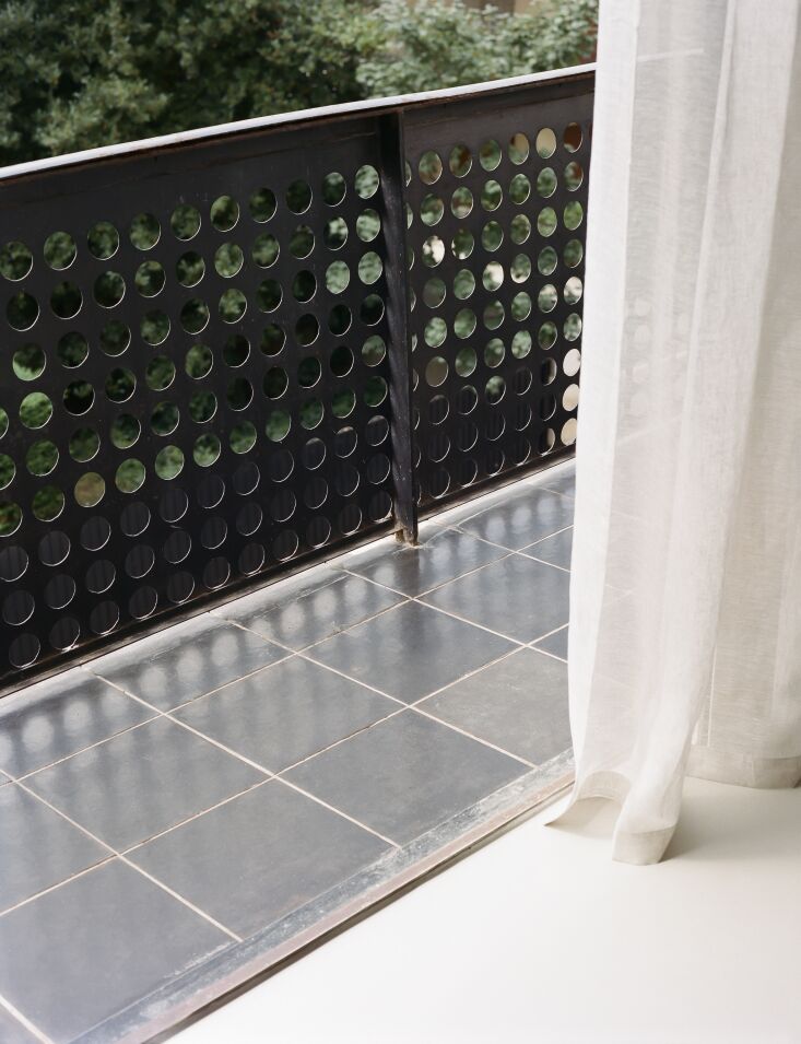 original tile and perforated metal railing on the molitor balcony. the flooring 31