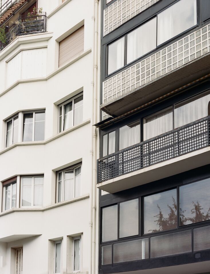 a view of the molitor building in contrast to a more typical parisian building  32