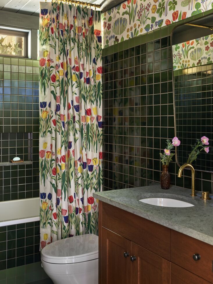 the tile is square heath ceramics tile in a glossy finish. the shower curtain i 26