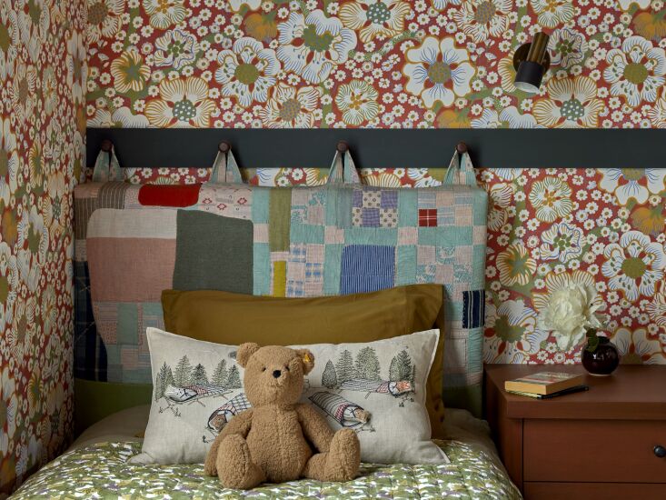 a custom peg rail headboard. on the bed is the coral & tusk stargazers pock 24