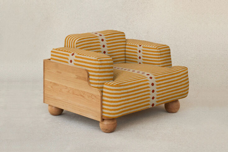 with a generous seat and inviting curves, this chunky armchair just begs for an 17