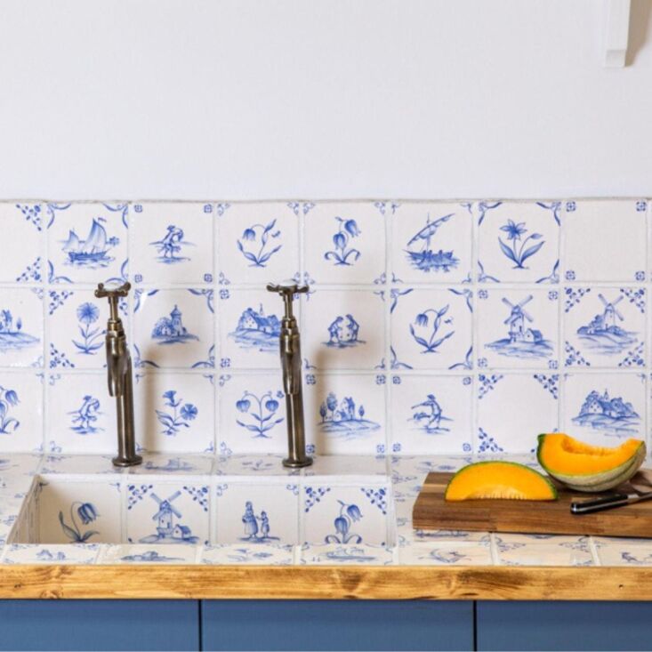 recipe for a bold sink: clad it entirely in delft tiles, like this one, done in 23