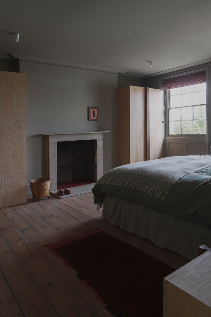 the main bedroom is finished in farrow & ball light gray no. \17. the ceili 30