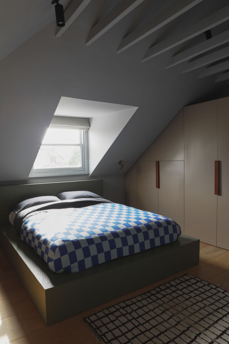 the attic room belongs to macnair&#8\2\17;s son. the bed frame is designed  24