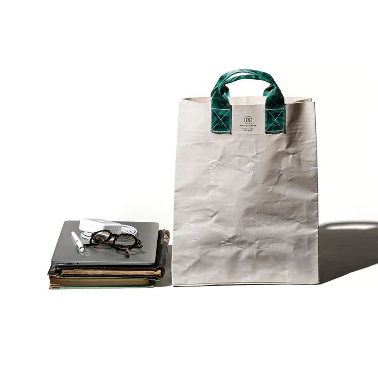 the puebco vintage recycled sling belt tote bag is made of recycled canvas lami 22