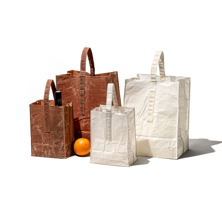 the grocery bag with handle is a waxed canvas version of the supermarket staple 20