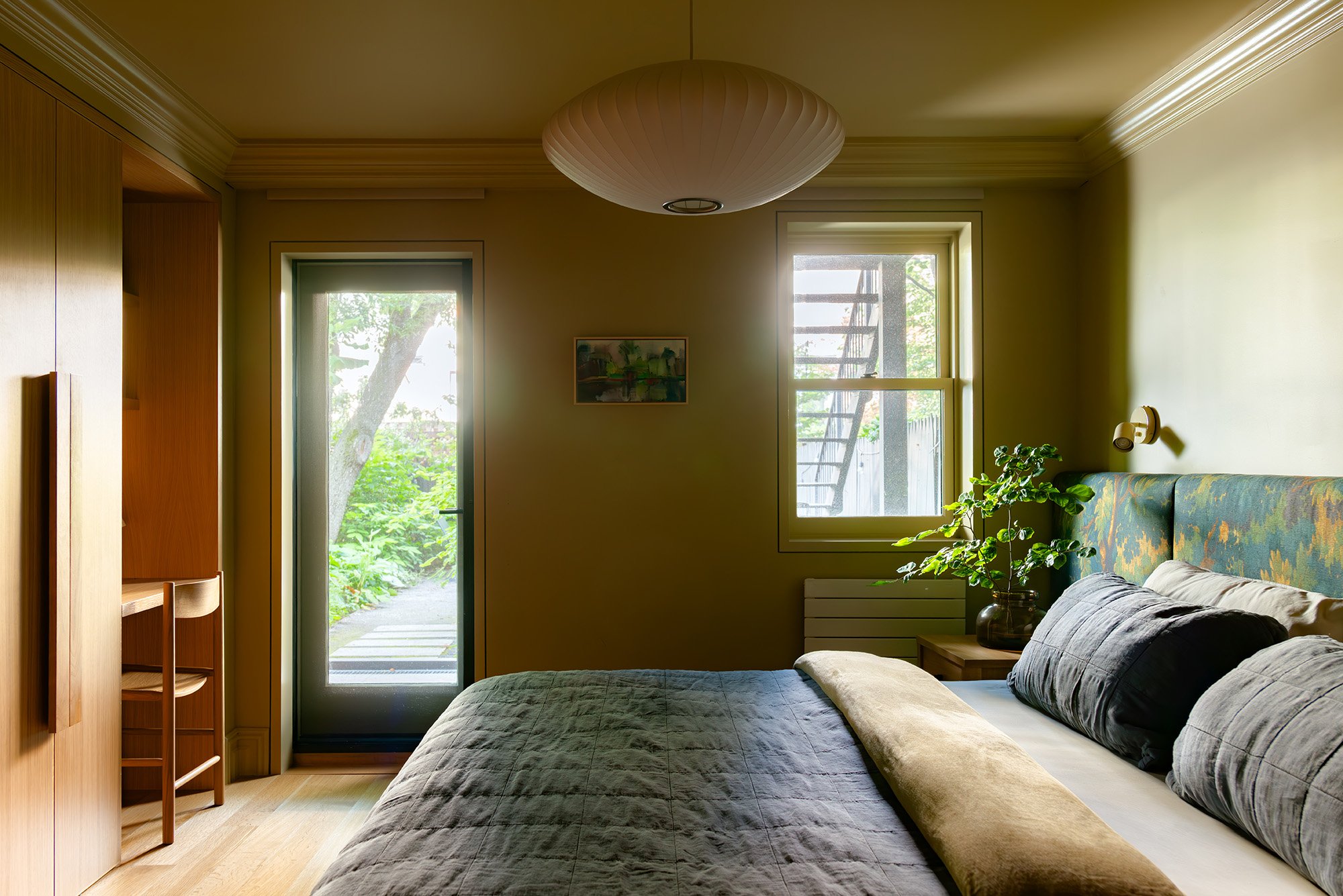 the main bedroom opens to the garden, which, says jess, helped supply the palet 22
