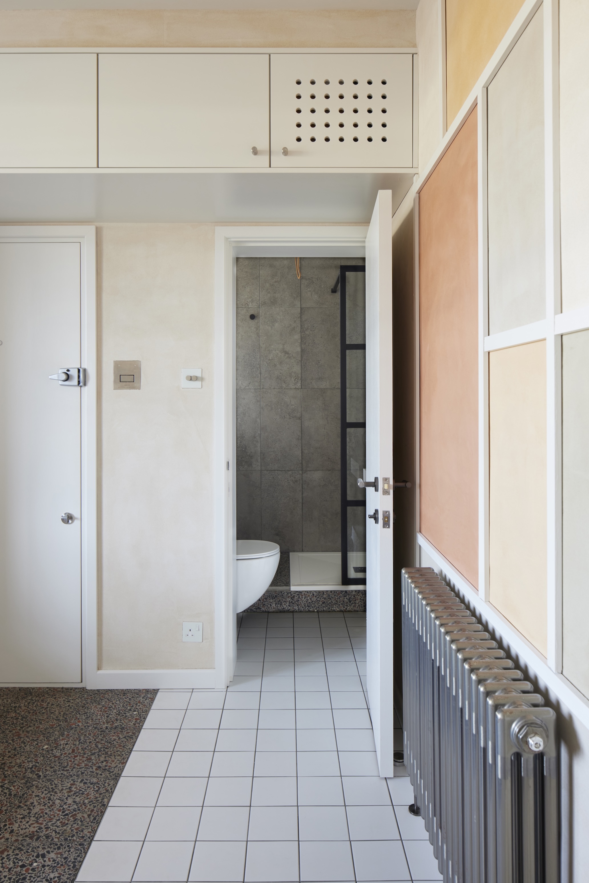 the ventilated cabinet over the powder room door conceals the wi fi router. 24