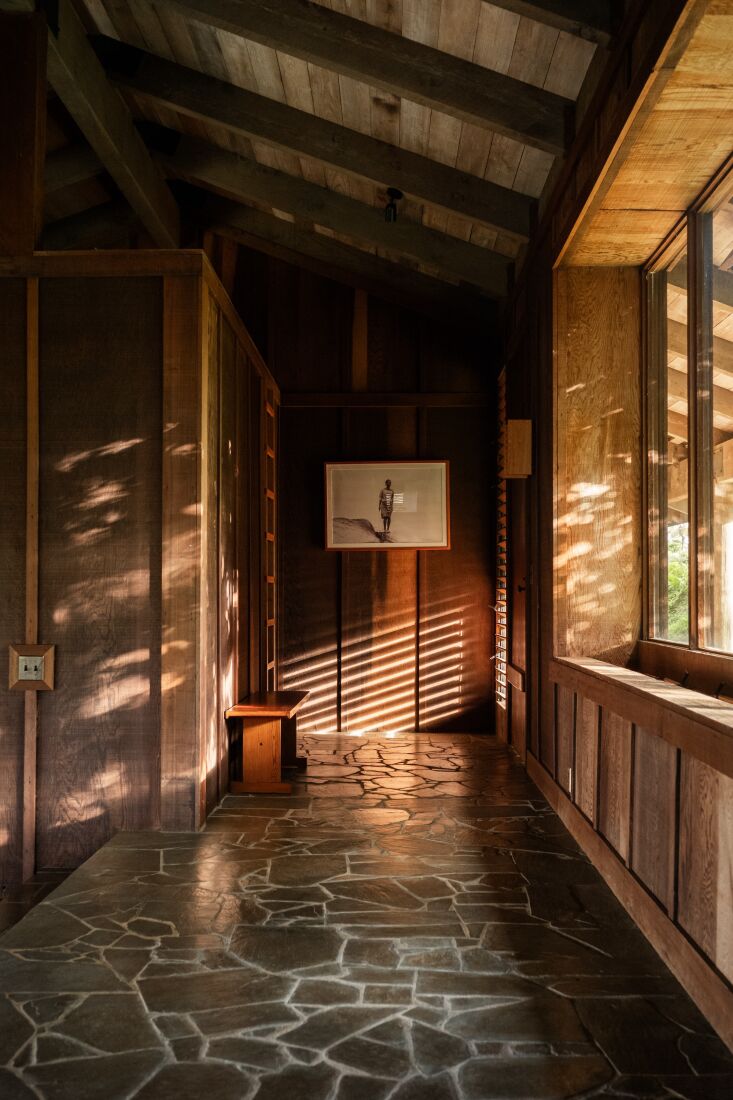 the entryway exemplifies the material palette of the house in a decidedly \1970 18