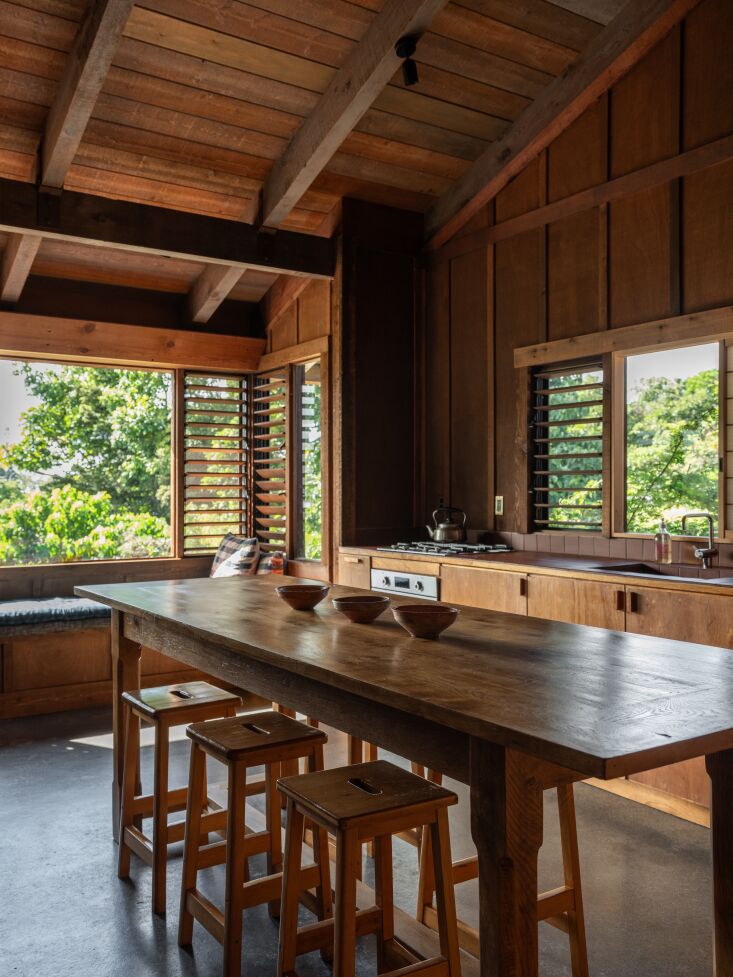 the kitchen is equipped with a terracotta tile countertop, a vola kv\1 faucet, 22