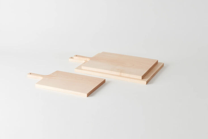 one of ehrlich\2\17;s maple cutting boards hangs on the wall behind the 34