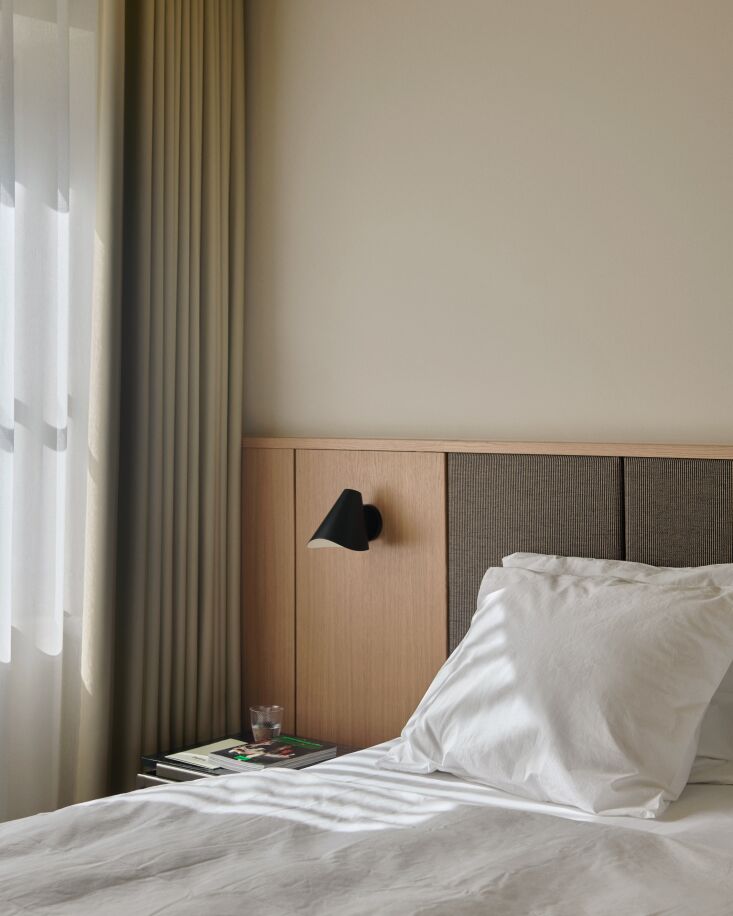 custom beds are softly lit by bonnet sconces from space copenhagen. 25
