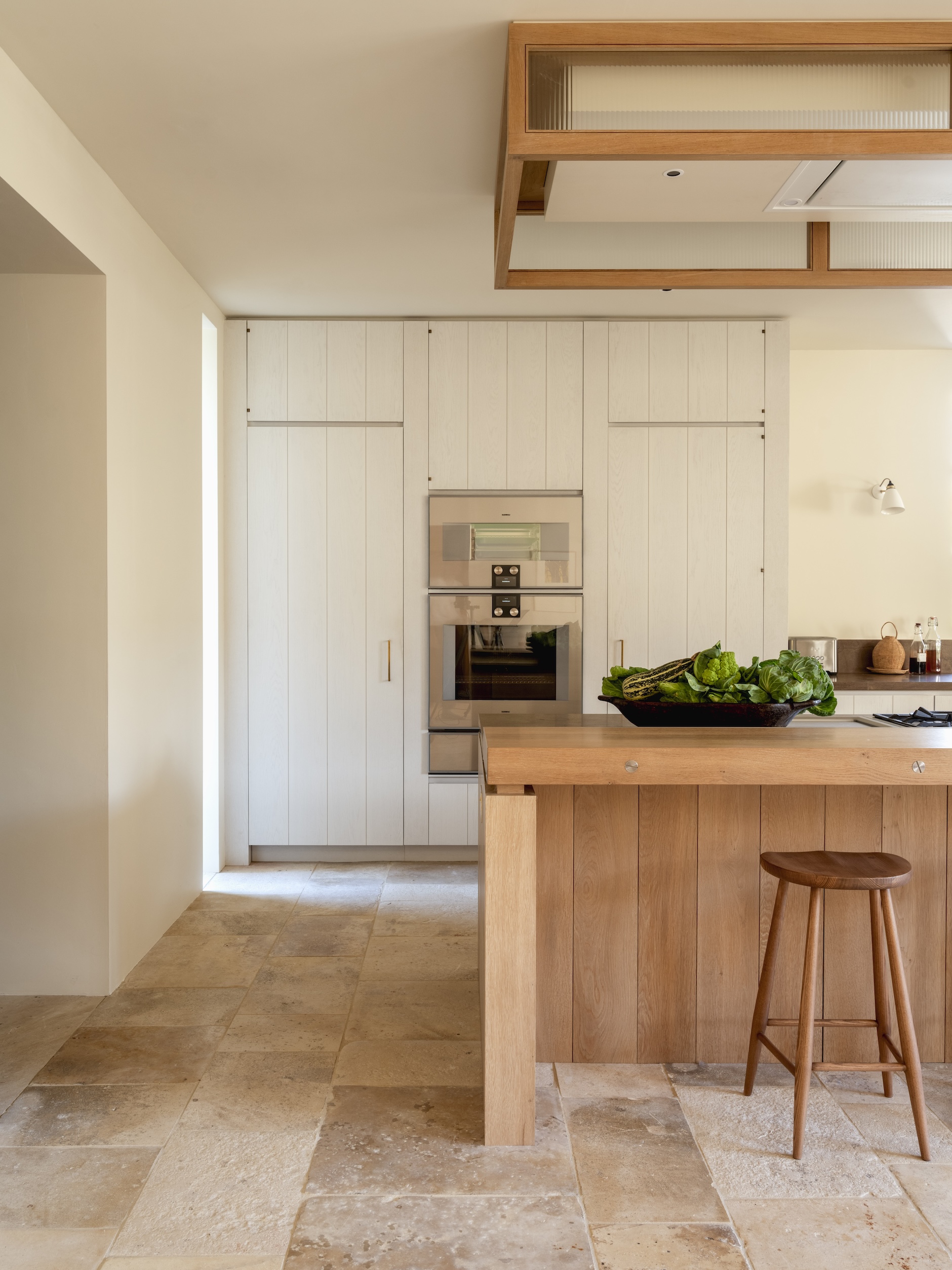 the stone floor is composed of reclaimed limestone flags from burgundy.  an ov 18