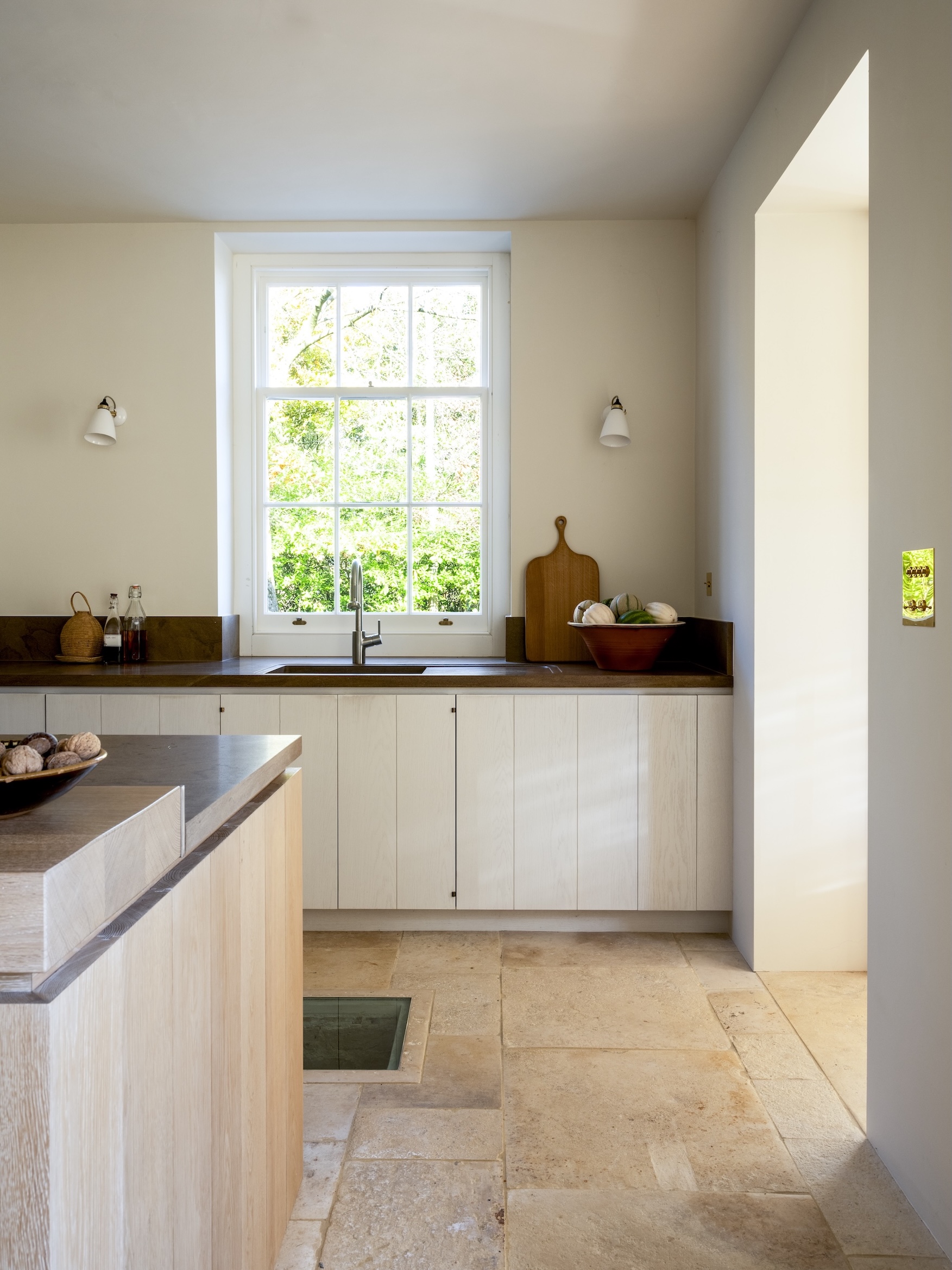 the lower half of the island and sink countertops are santafiora venata sandsto 19