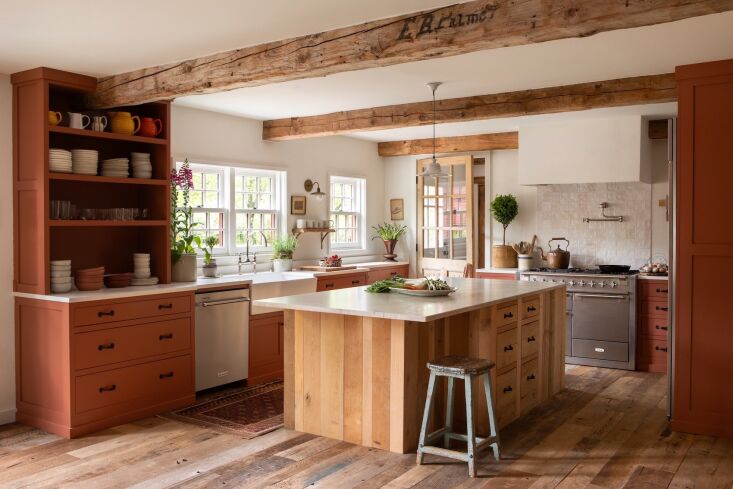 the kitchen island and terracotta cabinets were built by local cabinetmaker ros 23