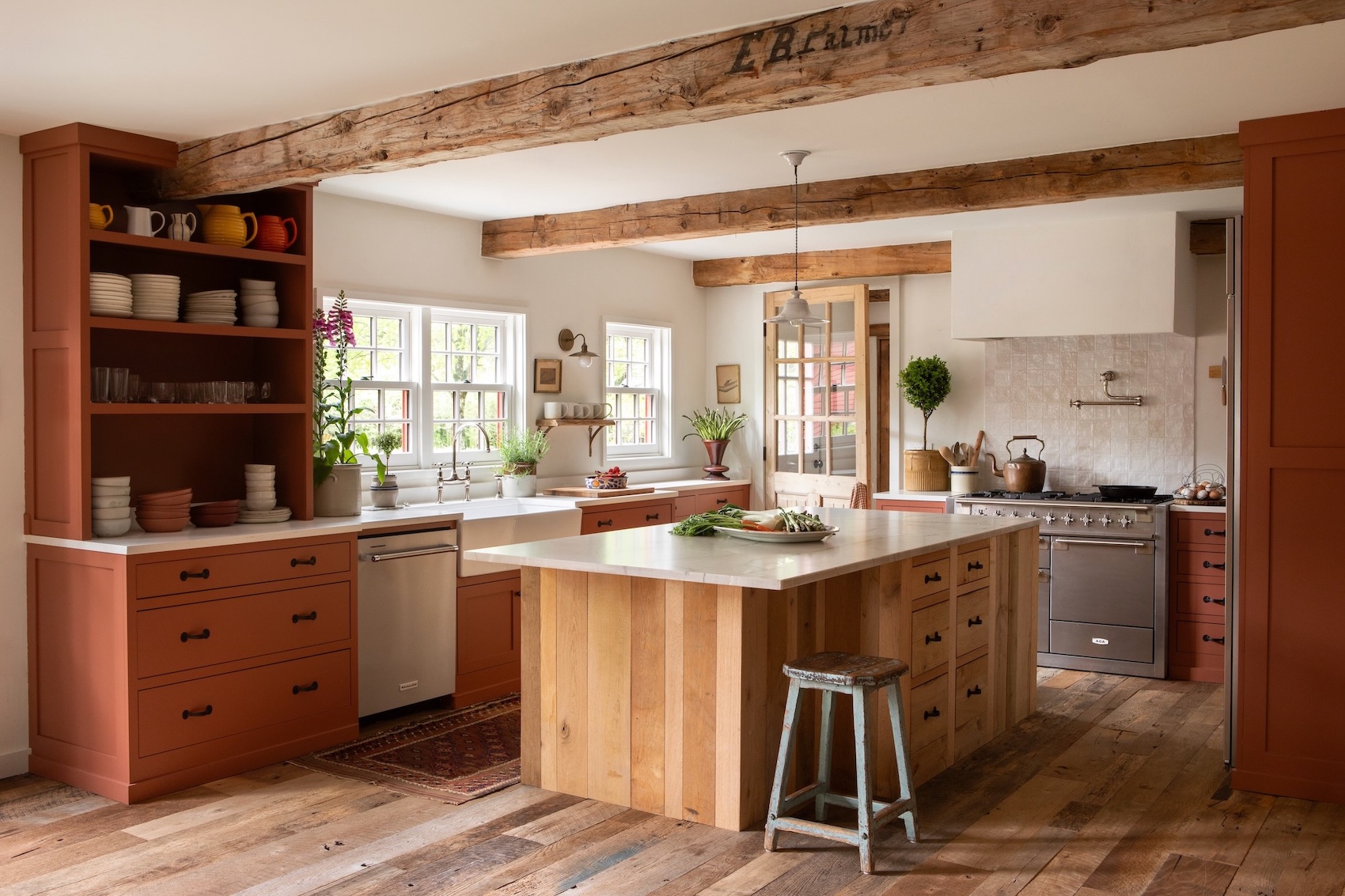 the kitchen island and terracotta cabinets were built by local cabinetmaker ros 23