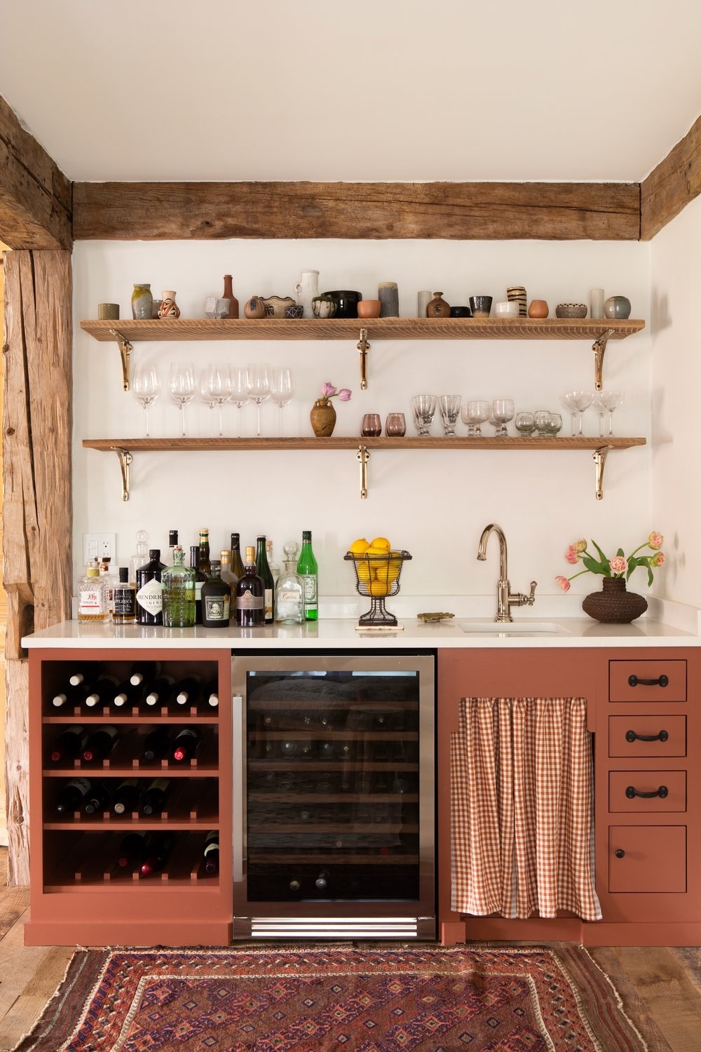 the couple opened the kitchen to the dining room and introduced a built in bar. 25