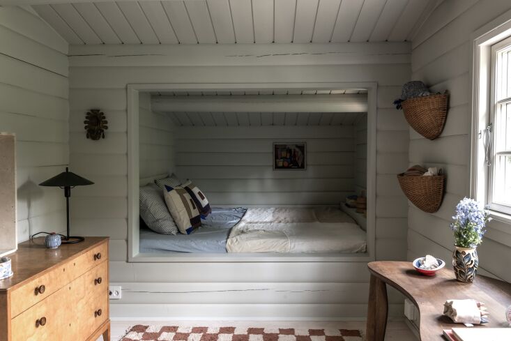 the designers found space to build a sleeping alcove out of what had been an in 26
