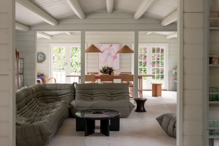 furnished with togo lounges, the living room opens to the dining room, a newly  18