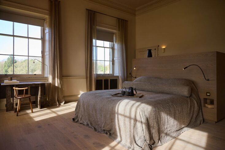 a guest room with draped linen coverlet. the yorkshire countryside is omniprese 23