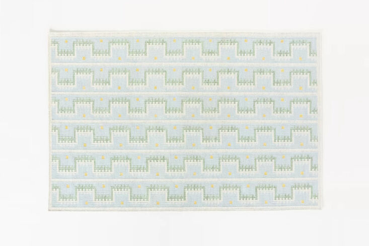 the handwoven wool scandi geometric rug is available in denim light (shown) and 21