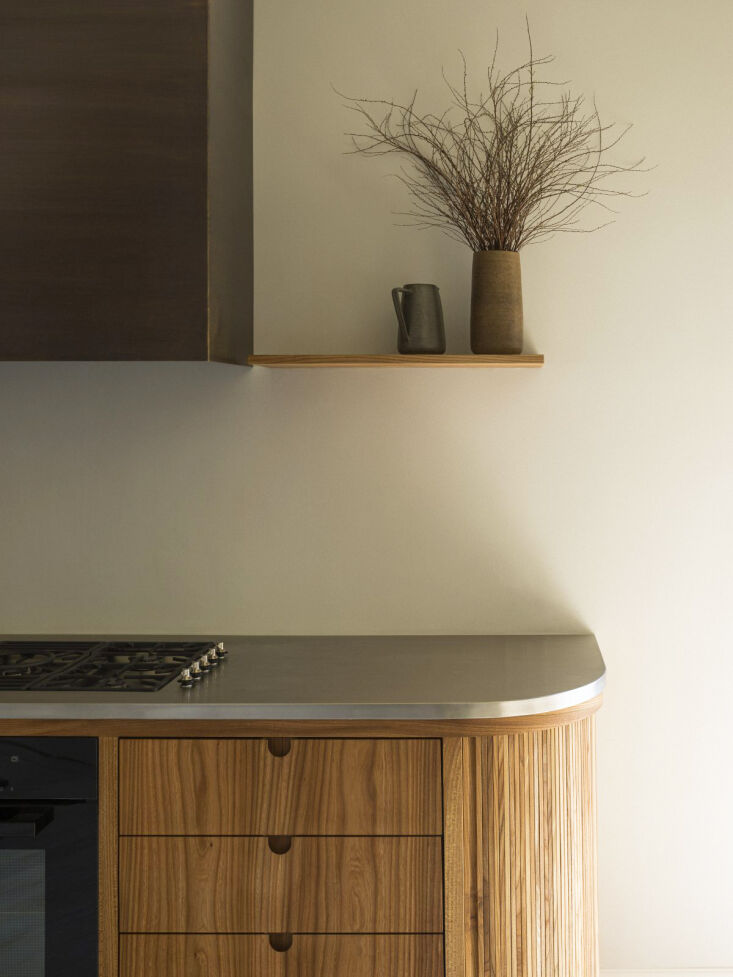 the custom stainless steel worktop was designed in collaboration with heartstee 21