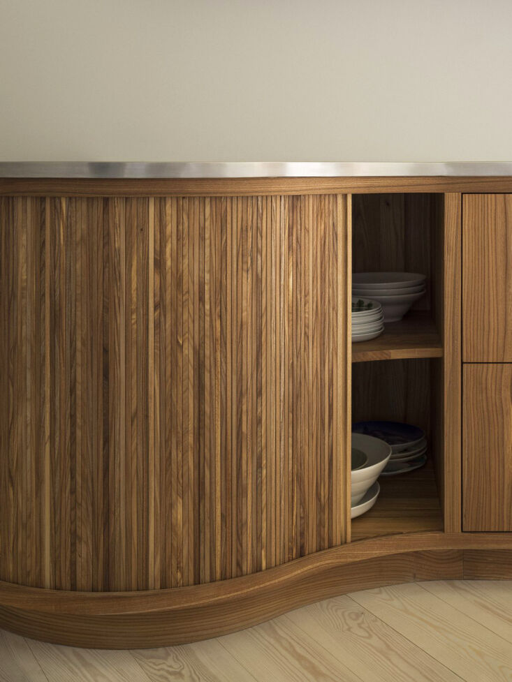 louvered cabinet fronts slide open for storage. 22