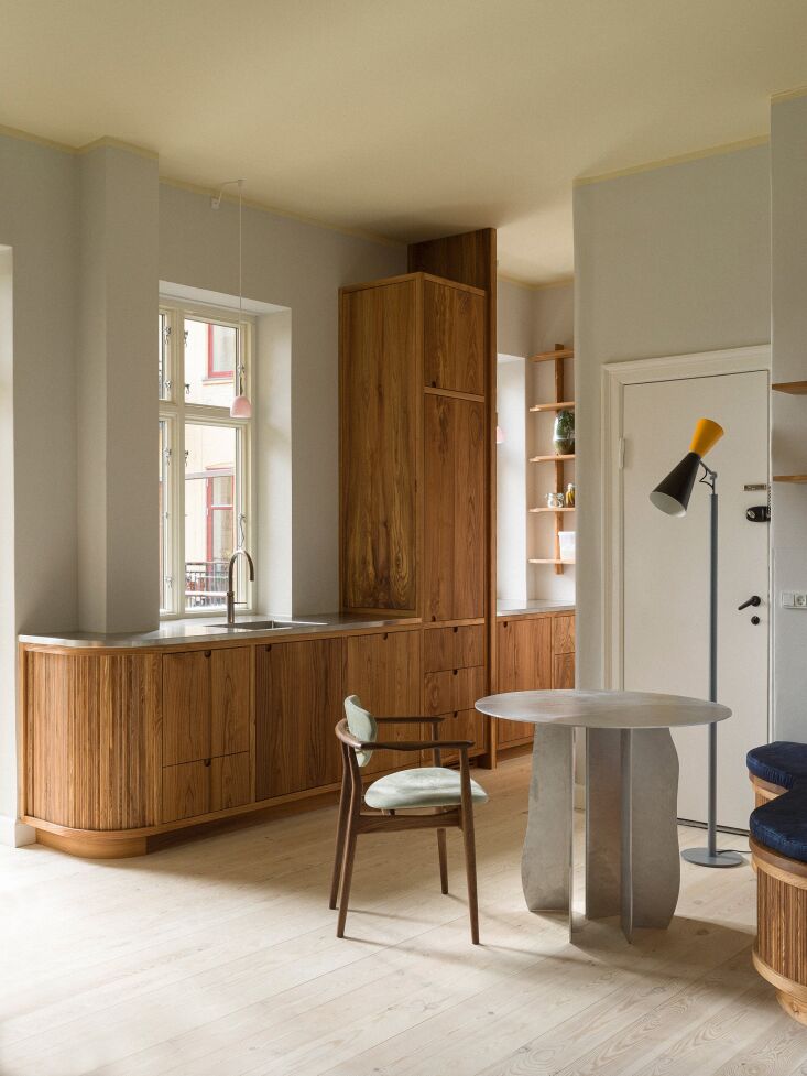 the dining table is by bahraini danish. the floor lamp is the le corbusier desi 25