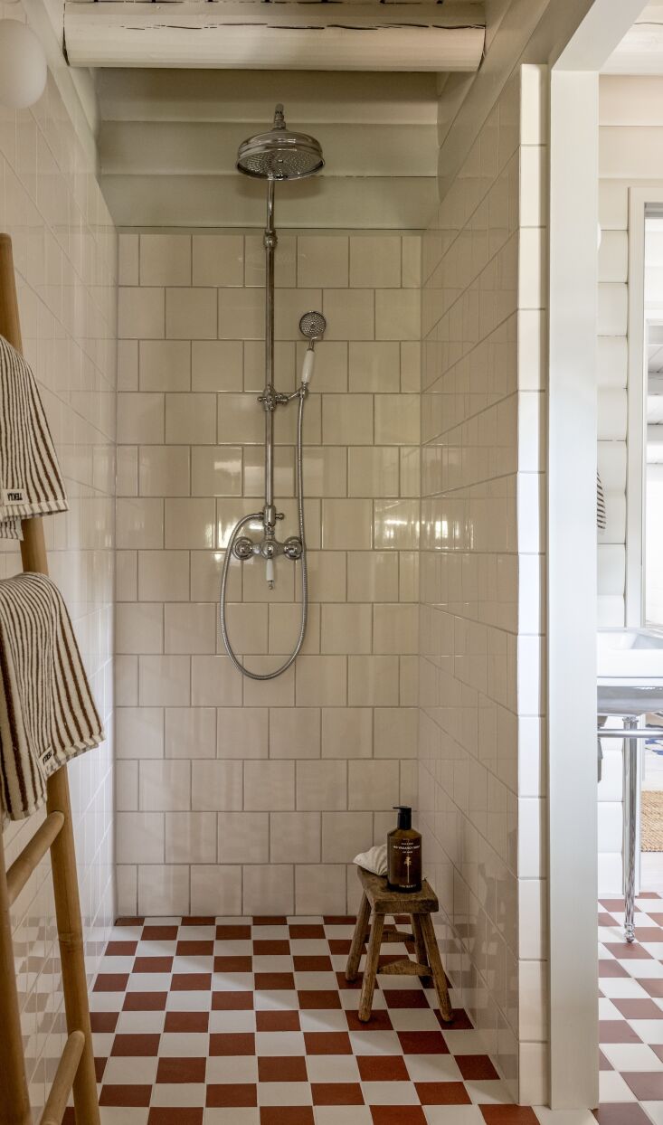the bathroom tiles, shower set, and sink were sourced from sekelskifte, a swedi 29