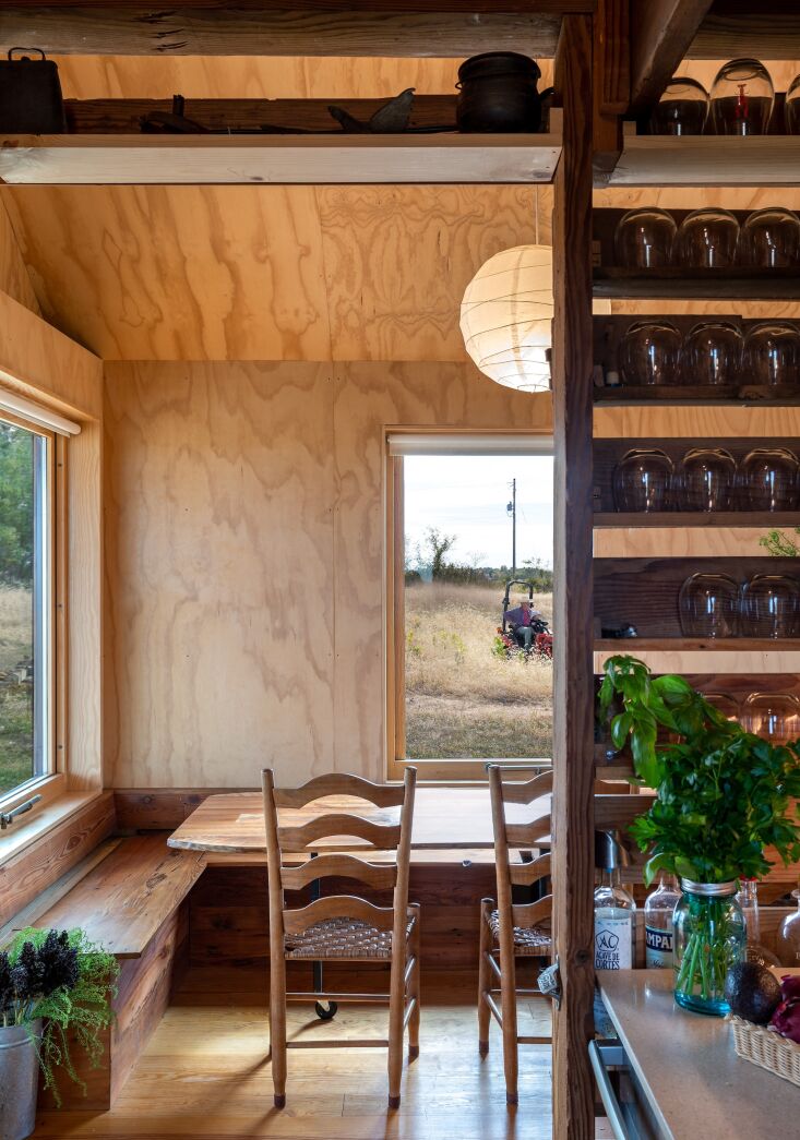 the view from the kitchen to the dining area. the galley kitchen is tiny but mi 22