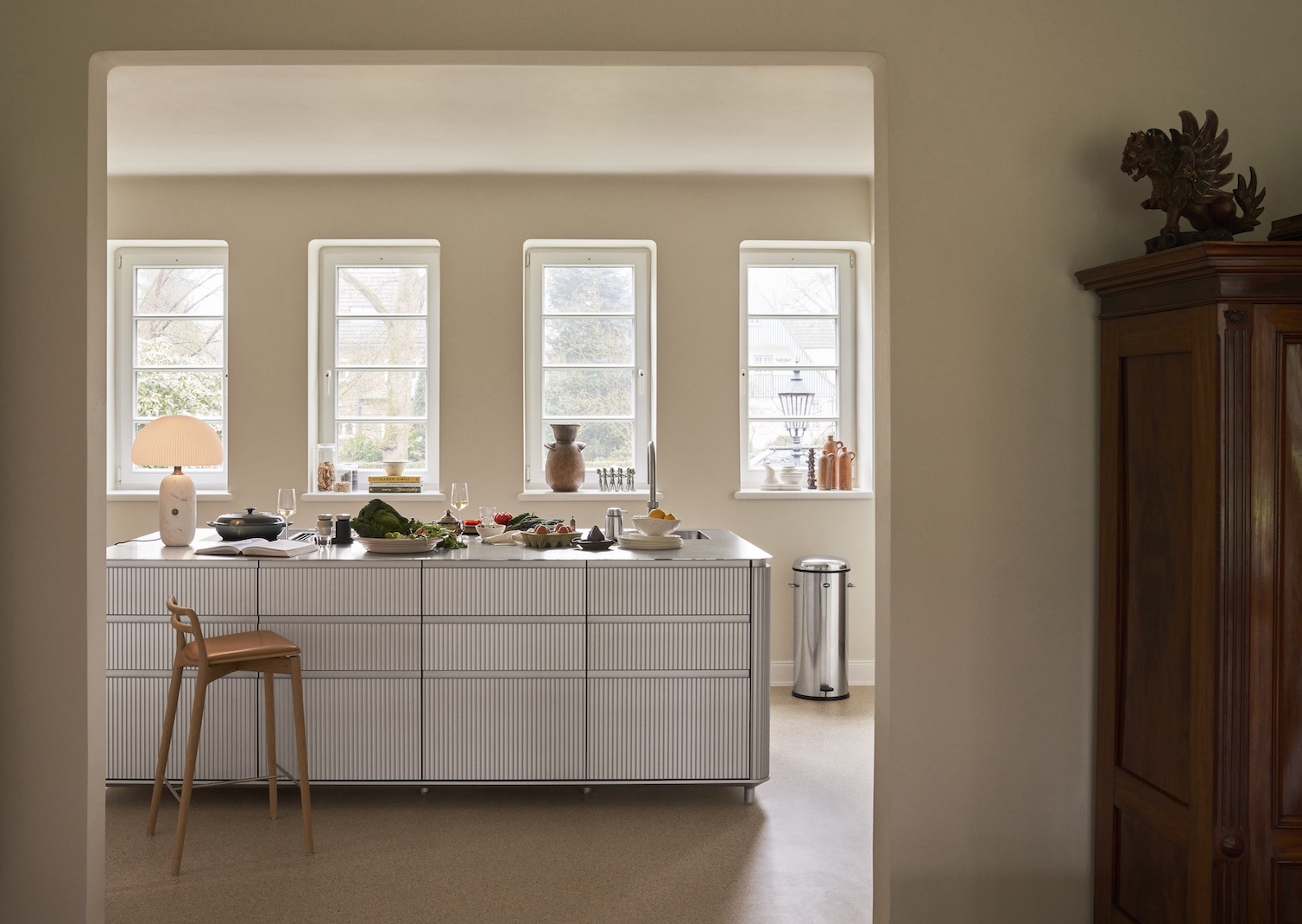 the vipp v3 island serves as a nearly all in one kitchen, containing an integra 18