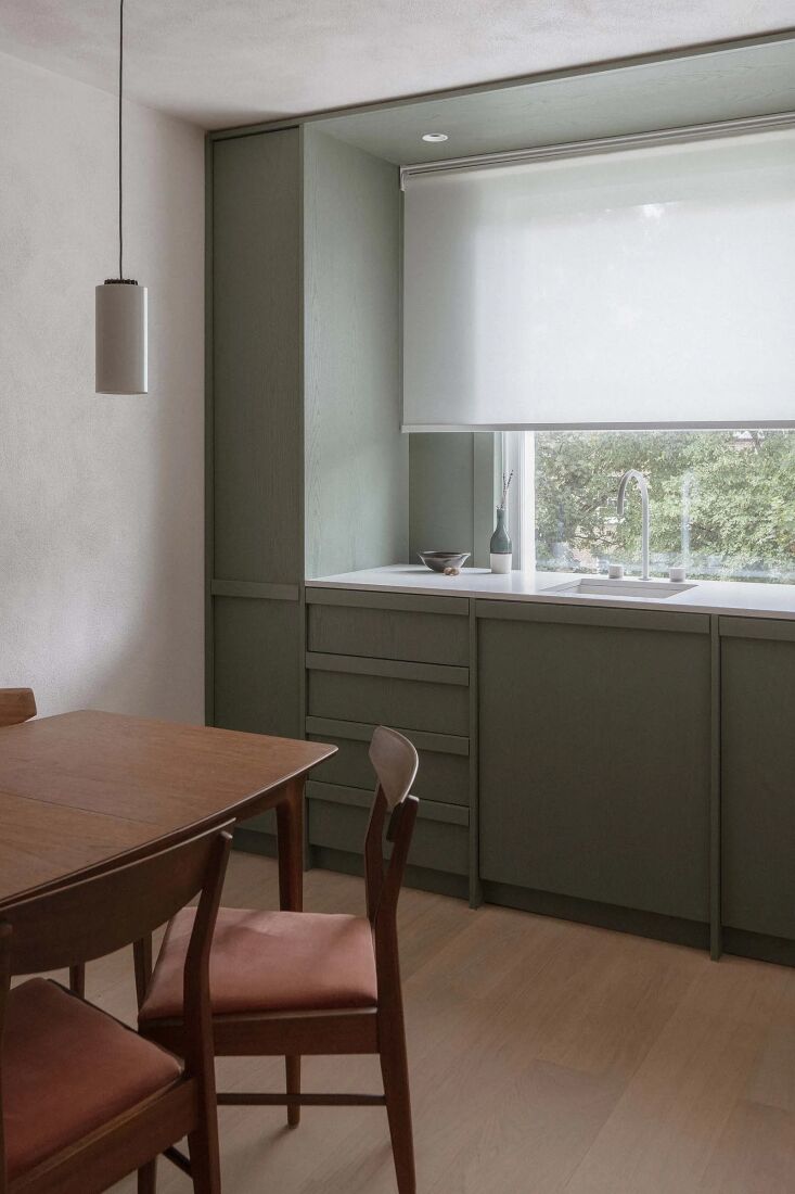 in the kitchen of highbury flat by architecture for london, plywood and ash ven 20