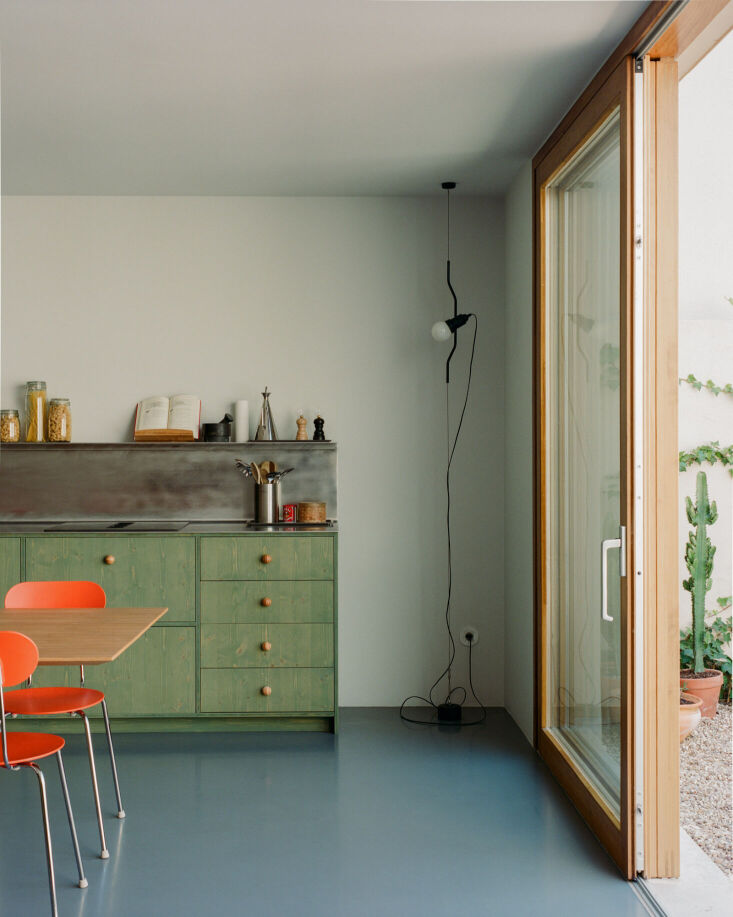 plywood cabinets and frames in a lisbon kitchen were stained in mid green and c 21