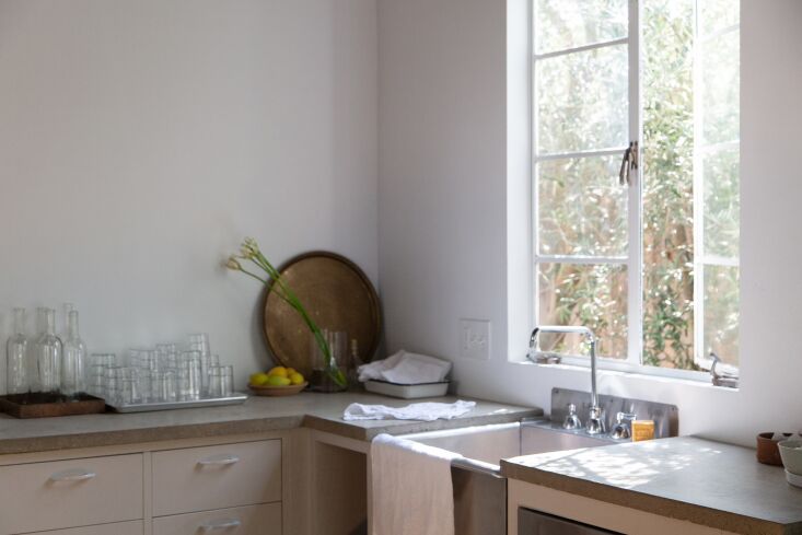 an appealing;y simple single bowl sink in a project by breland harper; see ‘c 17