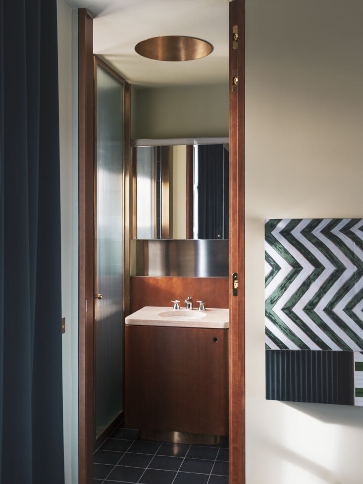 a small bath transformed with glamorous finishes from bronze and copper to cust 29