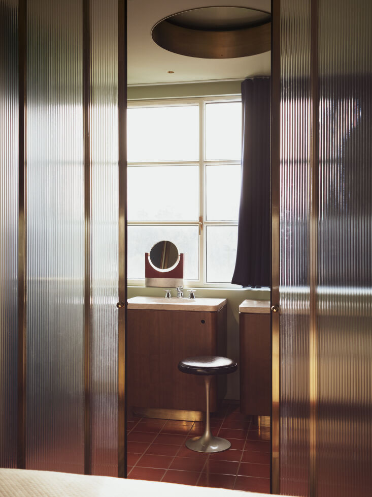 an angelo mangiarotti mirror in the bath complement the coral vietri tile floor 28