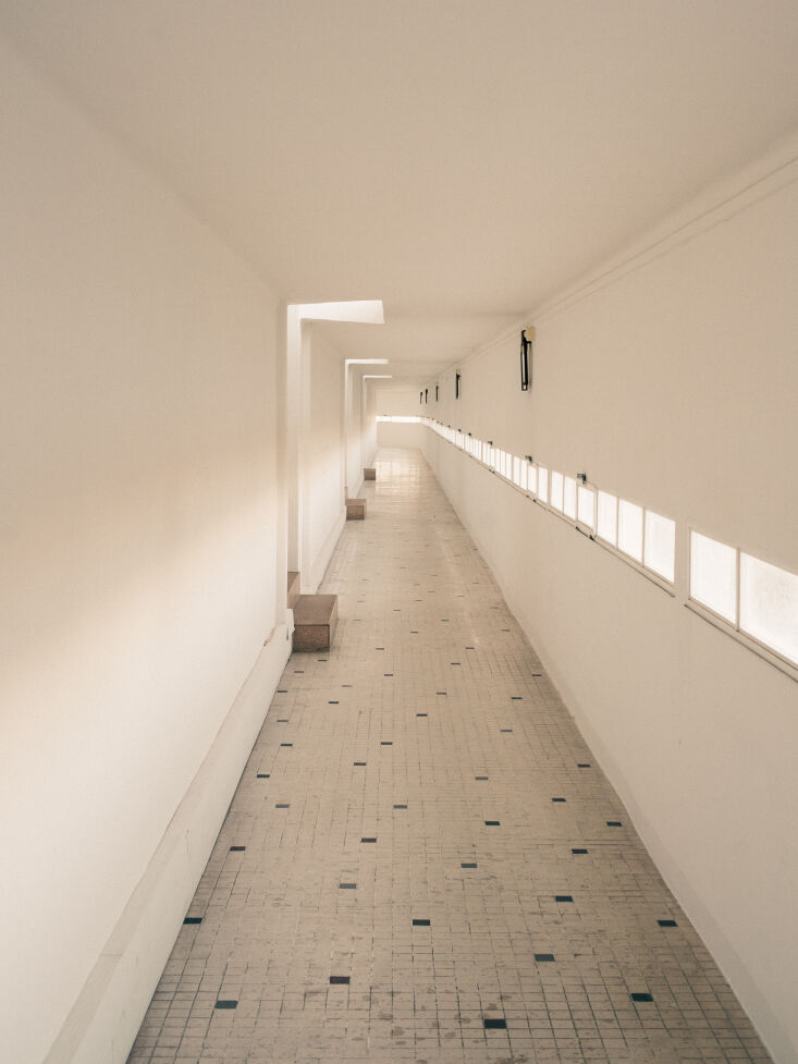 the long hallway of the latitude 43 reveals its past as a grand hotel. 19