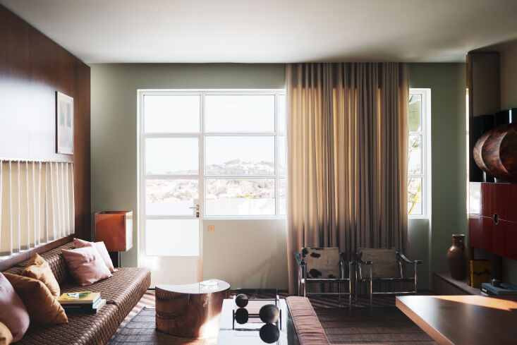 the view looking through the apartment and out onto the terrace. here, the desi 20