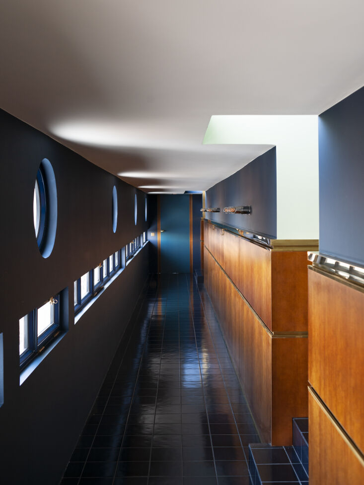a very nautical hallway is designed with cobalt tile and custom wood paneling p 26